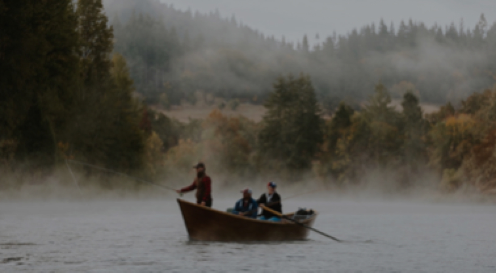 Picture of fishermen in a boat on a lake, slightly blurred