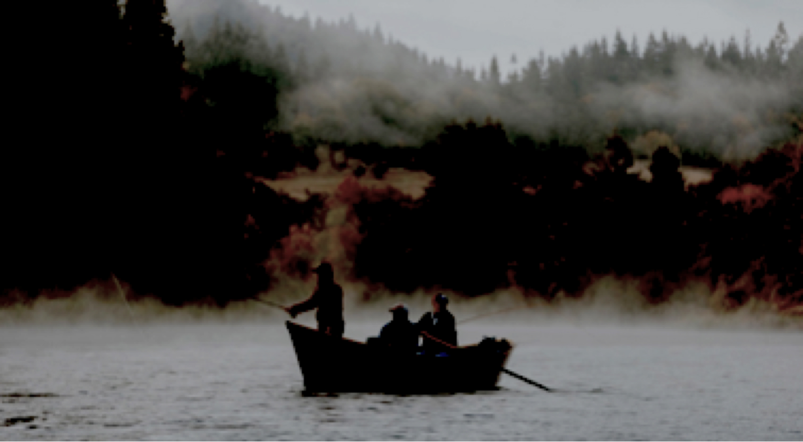 Picture of fishermen in a boat on a lake, degraded