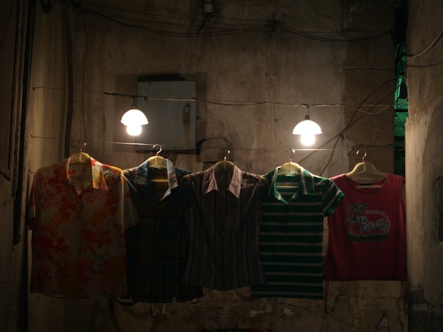 Clothes hanging to dry in the dark